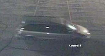 Security camera still of silver van.