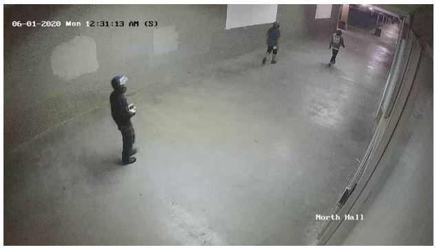 Individual captured on surveillance video at shopping center where fire occurred in Tulsa, Oklahoma.