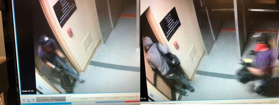 Camera image of suspects entering into a store.