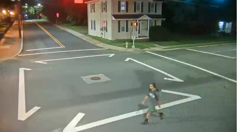 Unknown susptect walking across the street.