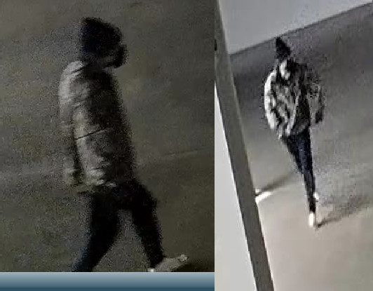 Suspect  is walking; wearing a black hat, black face mask, dark pants, white shoes and an army fatigue jacket. 