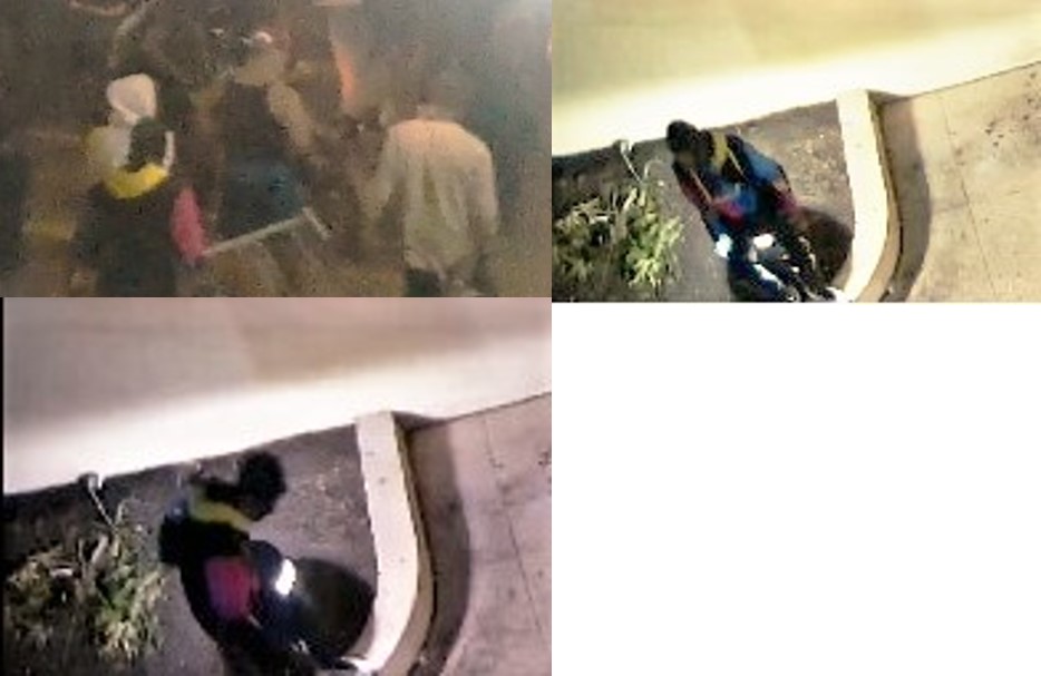 Arson suspect wearing a black, pink, neon yellow and blud hoodie dark colored pants.
