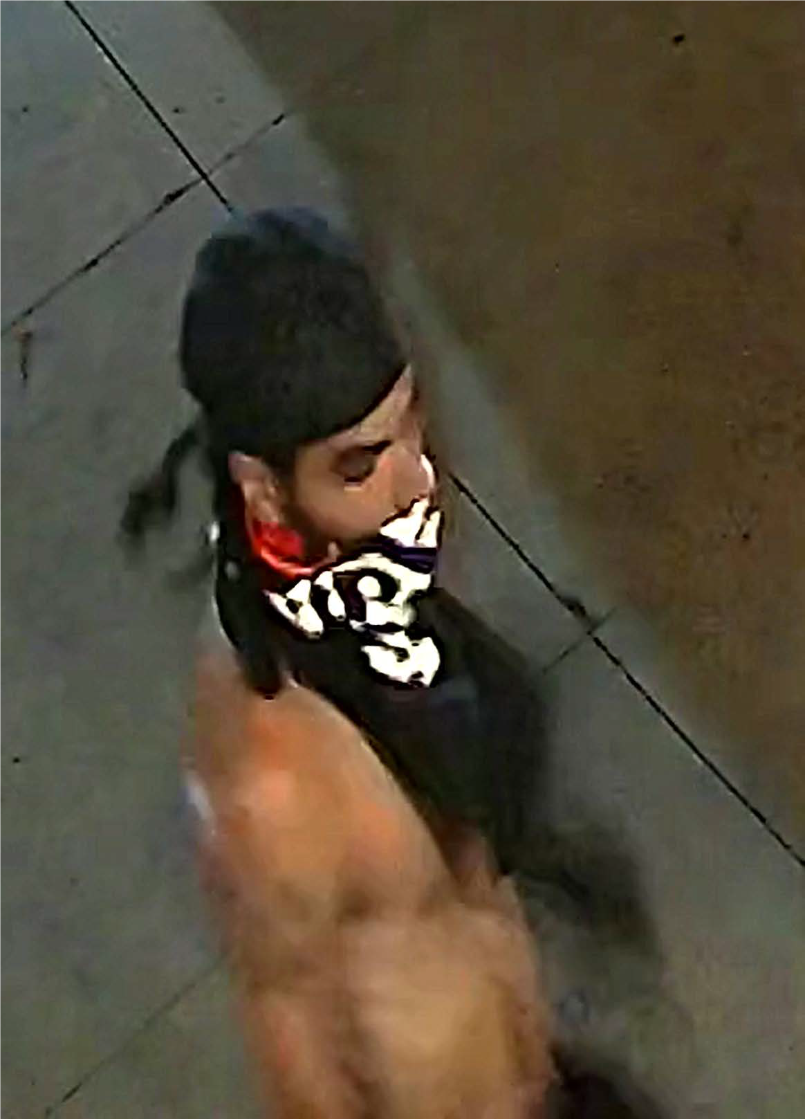 Male with no shirt, black pants, black hat and black t-shirt tied around the lower half of his face, identified as UNSUB #30.