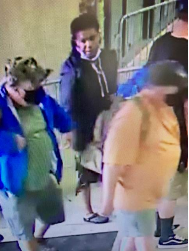 Suspect standing in line looking to the side