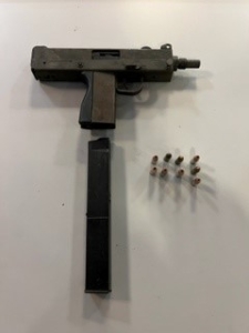 Automatic weapon with bullets next to it