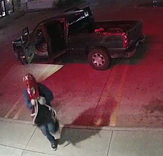 Suspect with mask leaving truck
