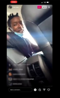 Screenshot of a social media page showing an individual in a car.