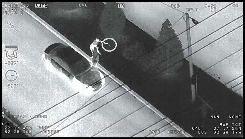 A person next to a vehicle.