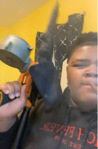 Defendant holding a machine gun