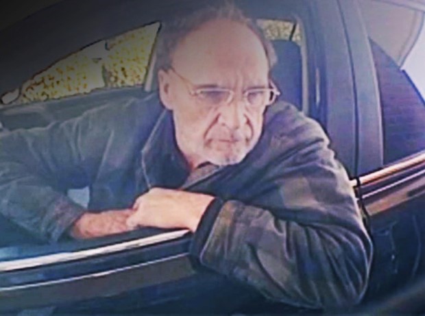 Kevin P. Anderson in the driver's seat of a car