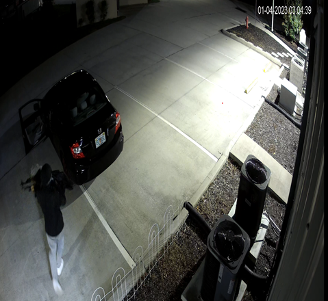 Suspect carrying firearms in a bag to a car