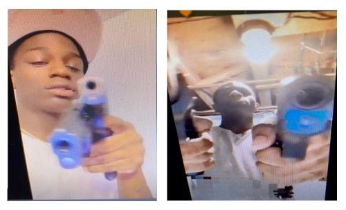 Suspect holding guns and pointing them at a camera