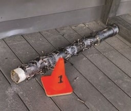 IED laying next to evidence cone