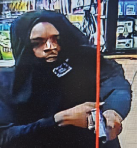 Suspect pointing a gun