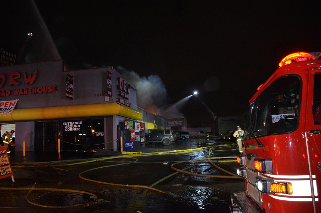 Firefighter's working on putting out the flames during the Off Road Warehouse fire.