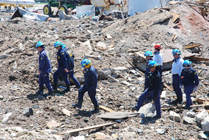 ATF Agents walking through a crime scene