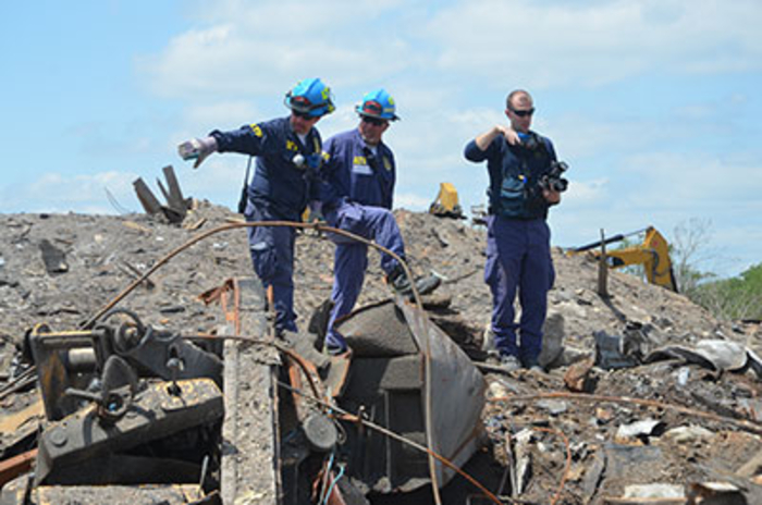 Agent pointing to debris