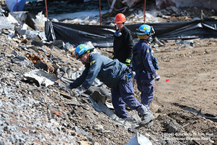 Agents inspecting debris