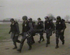 ATF agents carrying wounded person