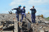 Agent pointing to debris