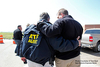 Agents hugging each other