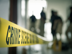 Yellow tape in front of a crime scene
